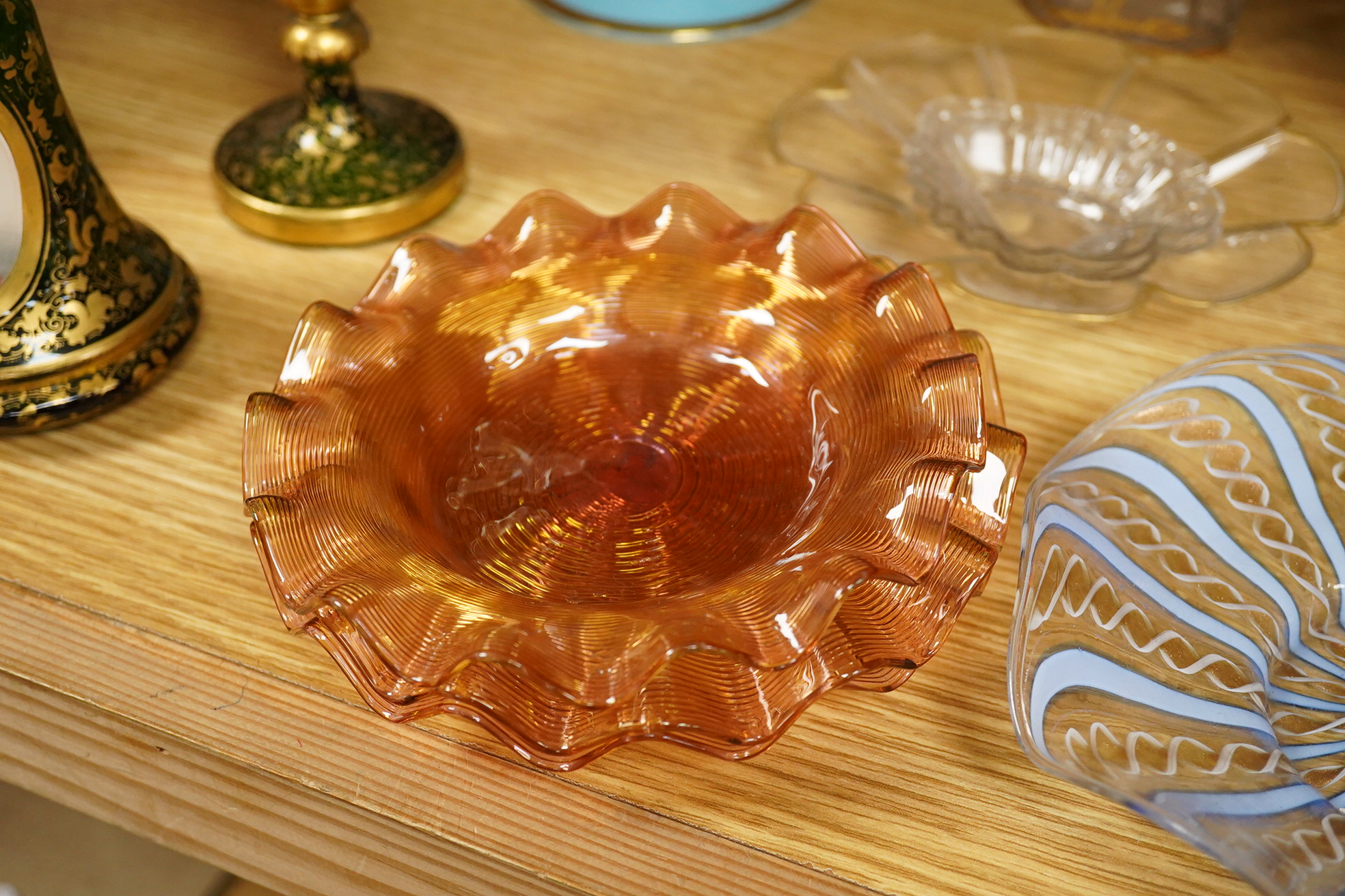 A Victorian gilt and enamelled green glass decanter, a similar vase, a small square decanter, Venetian dishes, silver plated coasters, etc
